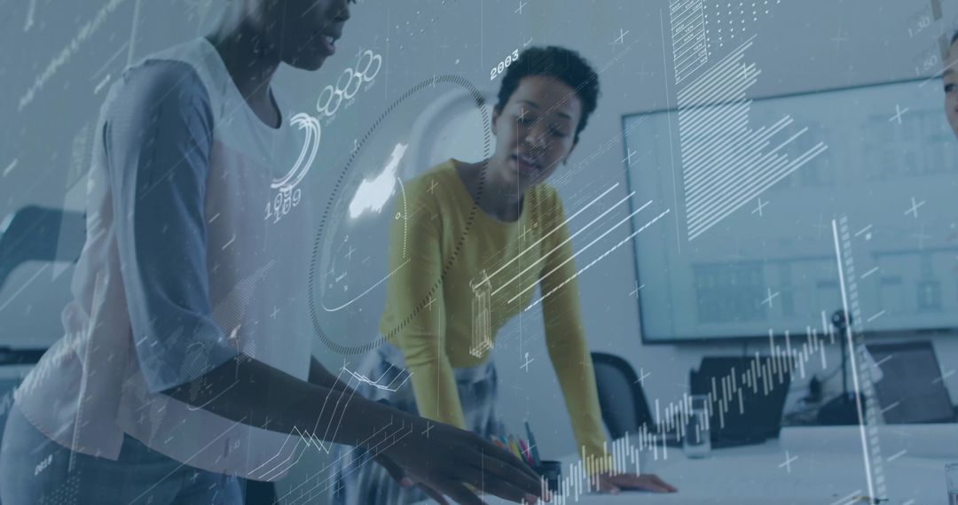 Colleagues Collaborating on Innovative Data Analysis in Modern Workspace