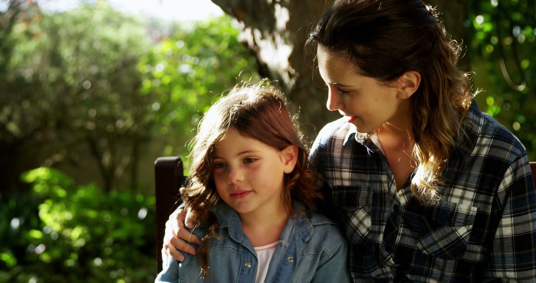 Mother Consoling Young Daughter Outdoors on Sunny Day - Free Images, Stock Photos and Pictures on Pikwizard.com