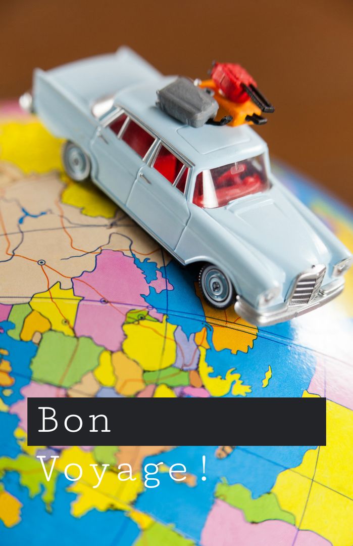 Celebrating travel adventures, a toy car on a colorful map evokes ...