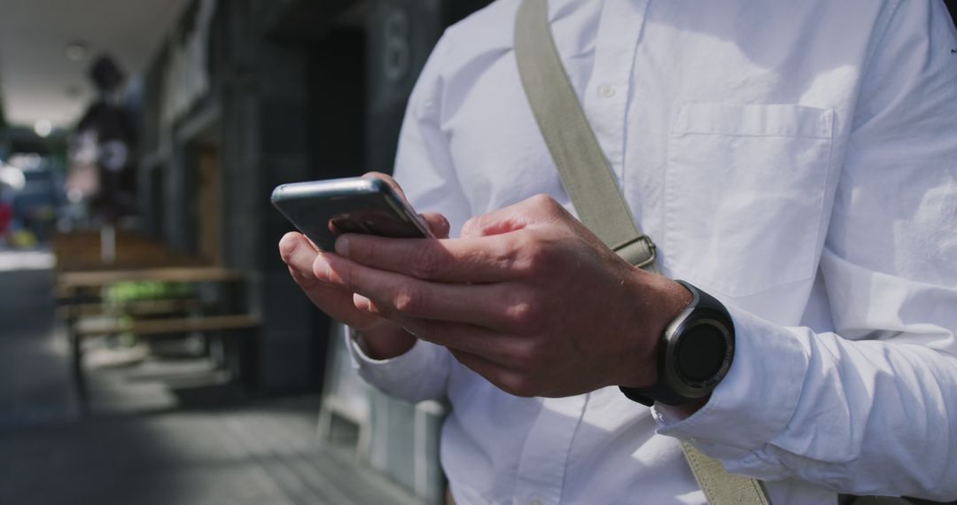 Businessman Texting on Smartphone Outdoor Wearing White Shirt - Free Images, Stock Photos and Pictures on Pikwizard.com