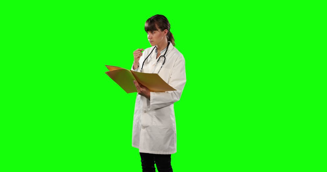 Doctor Reviewing Patient Records on Green Screen Background - Free Images, Stock Photos and Pictures on Pikwizard.com