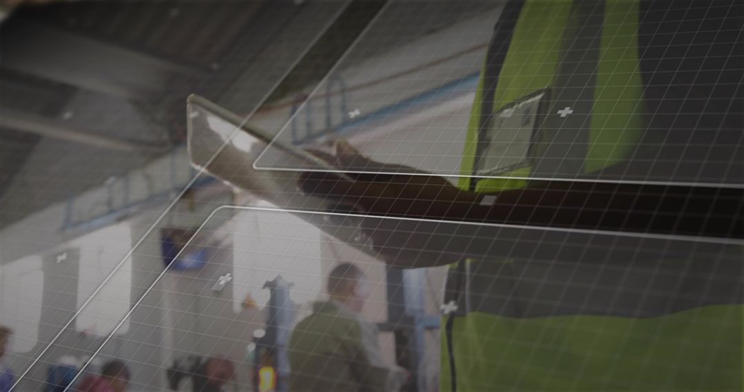 Technician Using Tablet in Industrial Hallway