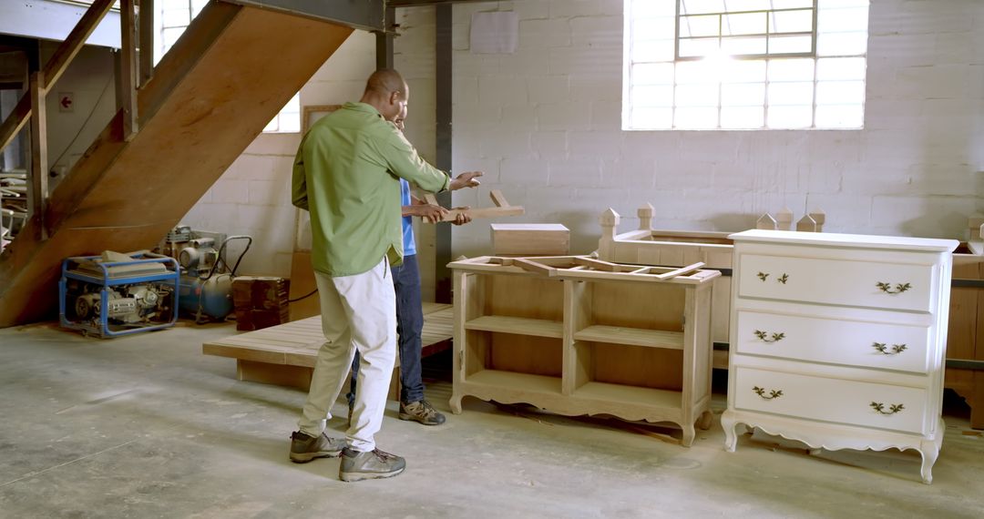 Skilled Carpenters in Workshop Preparing Dresser Frame