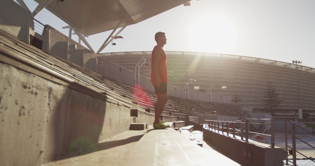 Athlete Training in Stadium Stand at Sunrise - Free Images, Stock Photos and Pictures on Pikwizard.com