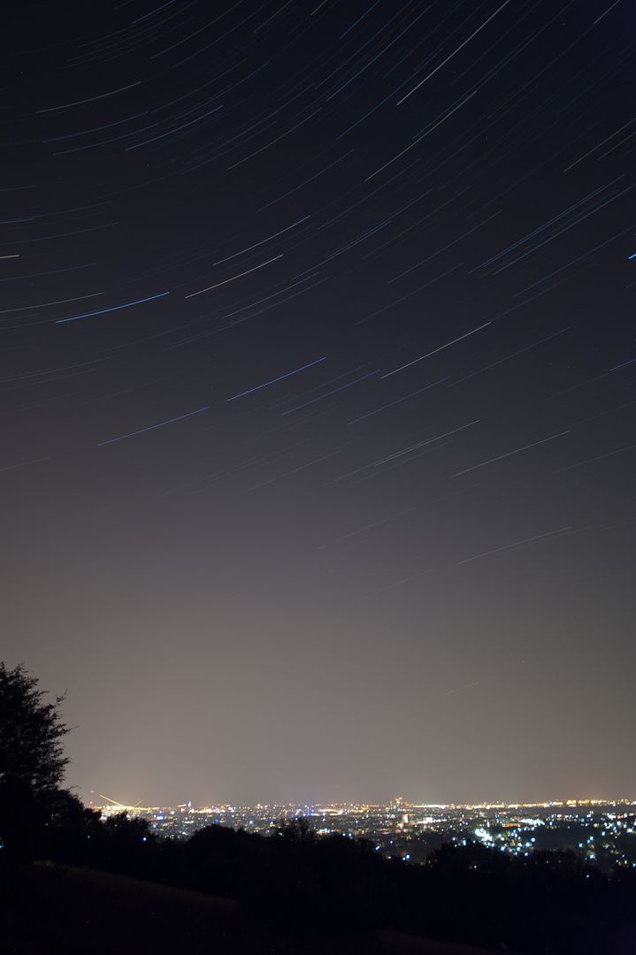 Star Trails Over Cityscape at Night - Free Images, Stock Photos and Pictures on Pikwizard.com