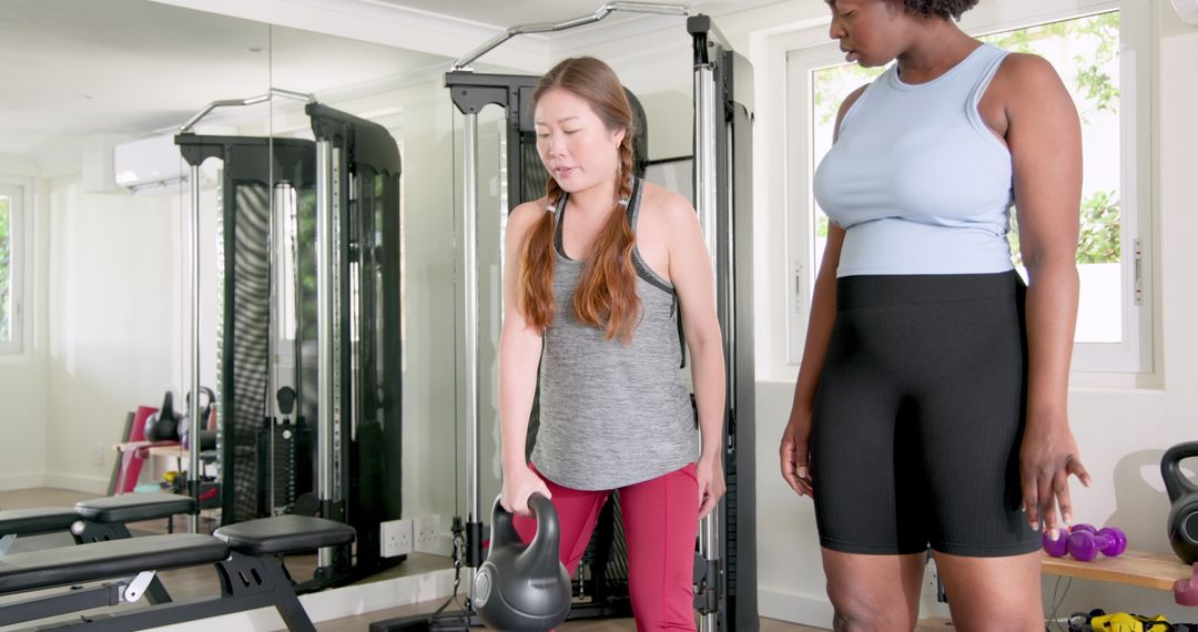 Diverse Fitness Training with Kettlebells in Modern Gym