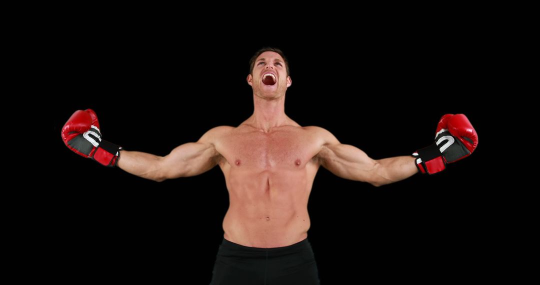 Triumphant Shirtless Boxer with Outstretched Arms Celebrating Victory - Free Images, Stock Photos and Pictures on Pikwizard.com