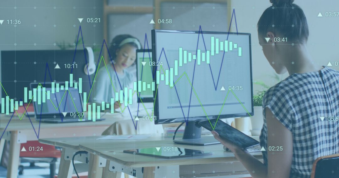 Women Analyzing Financial Charts on Computer Monitors in Modern Office - Free Images, Stock Photos and Pictures on Pikwizard.com