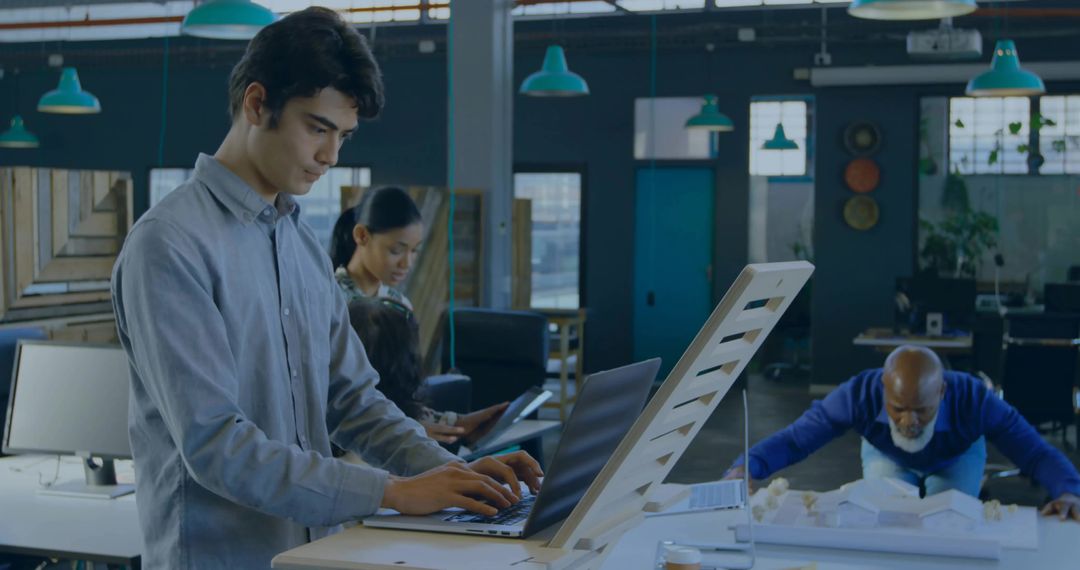 Focused Young Professional in Modern Collaborative Workspace