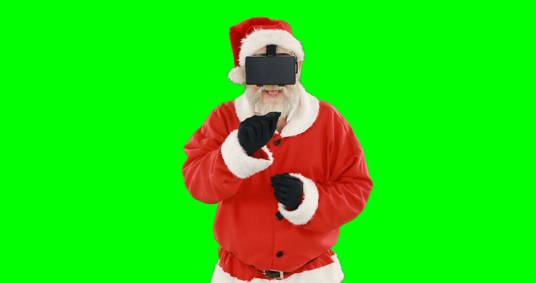 Santa Claus with Virtual Reality Headset Celebrating in Front of Green Screen - Free Images, Stock Photos and Pictures on Pikwizard.com