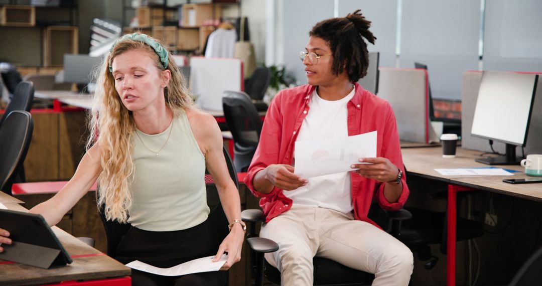 Modern Office Professionals Collaborating on Project