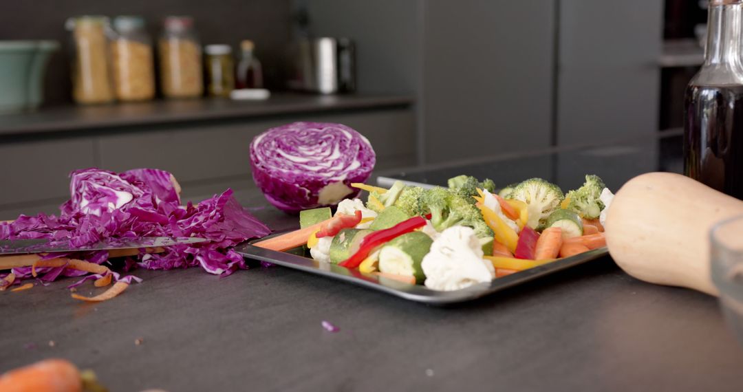 Fresh Vegetables and Purple Cabbage on Cutting Board in Modern Kitchen - Free Images, Stock Photos and Pictures on Pikwizard.com