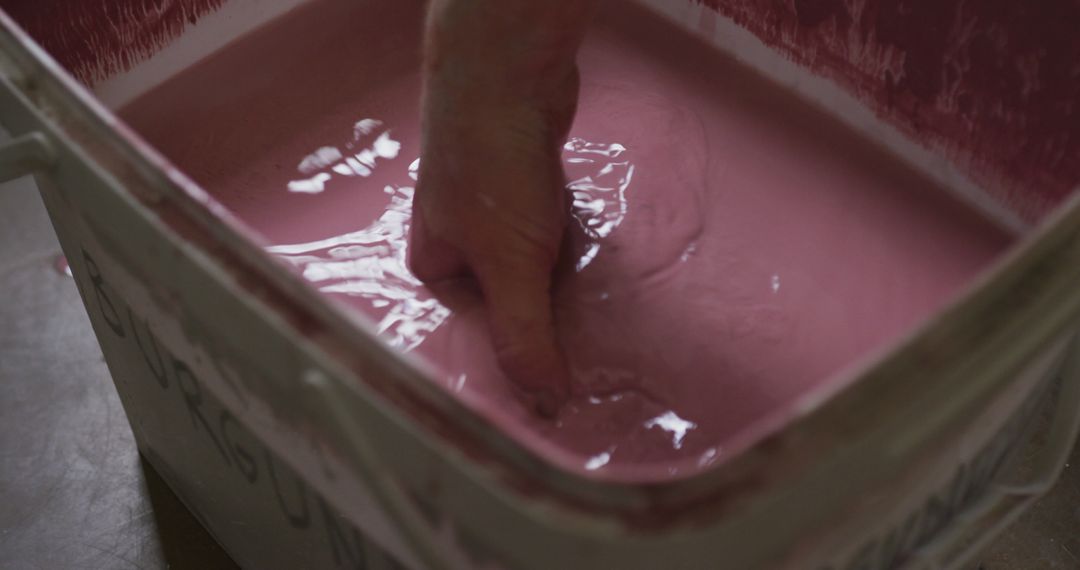 Hand Mixing Pink Liquid in Large Container - Free Images, Stock Photos and Pictures on Pikwizard.com