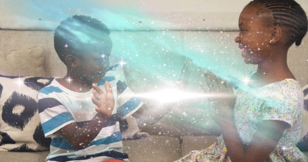 Joyful African-American Siblings Playing Hand Clapping Game with Sparkle Effects