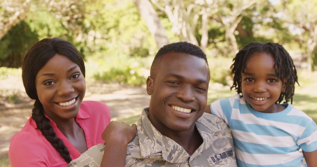 Proud Military Family Smiling in Open Park Setting