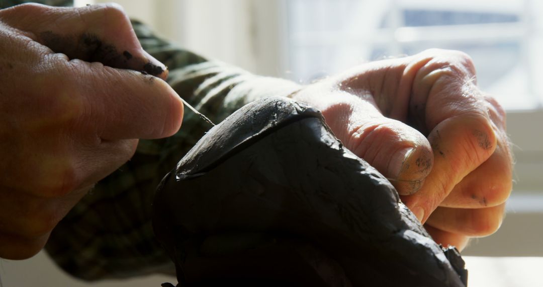 Close-Up of Sculptor Shaping Clay with Hands and Tool - Free Images, Stock Photos and Pictures on Pikwizard.com