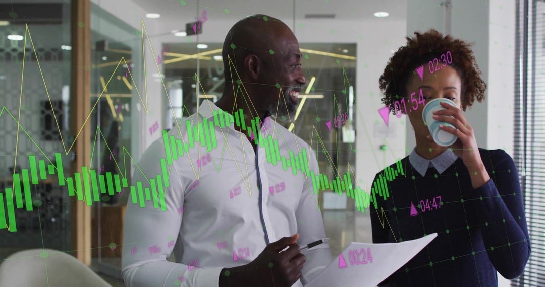 Professionals in Smart Casual Discussing Digital Data in Modern Office