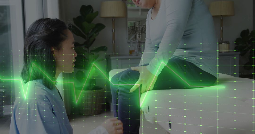 Physiotherapist with Patient Analyzing Digital Medical Data