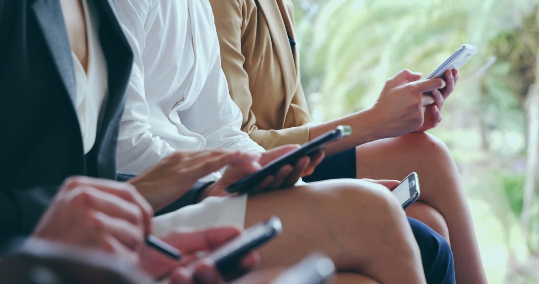 Work Colleagues Using Mobile Devices for Communication