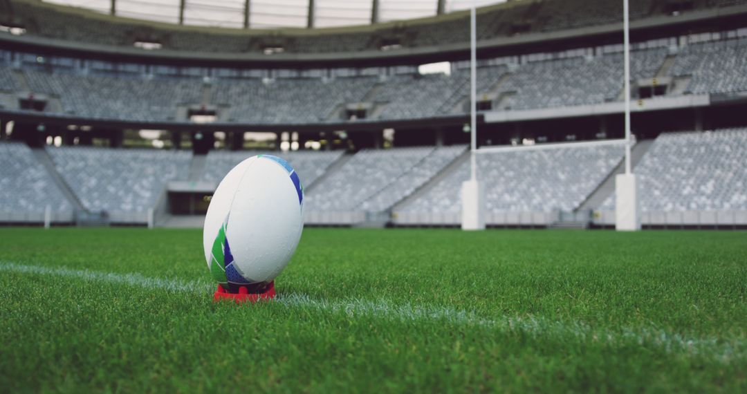 Rugby Ball Standing on Tee in Empty Stadium - Free Images, Stock Photos and Pictures on Pikwizard.com