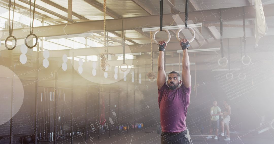 Man Engaged in Gym Ring Workout with Digital Interface Overlay