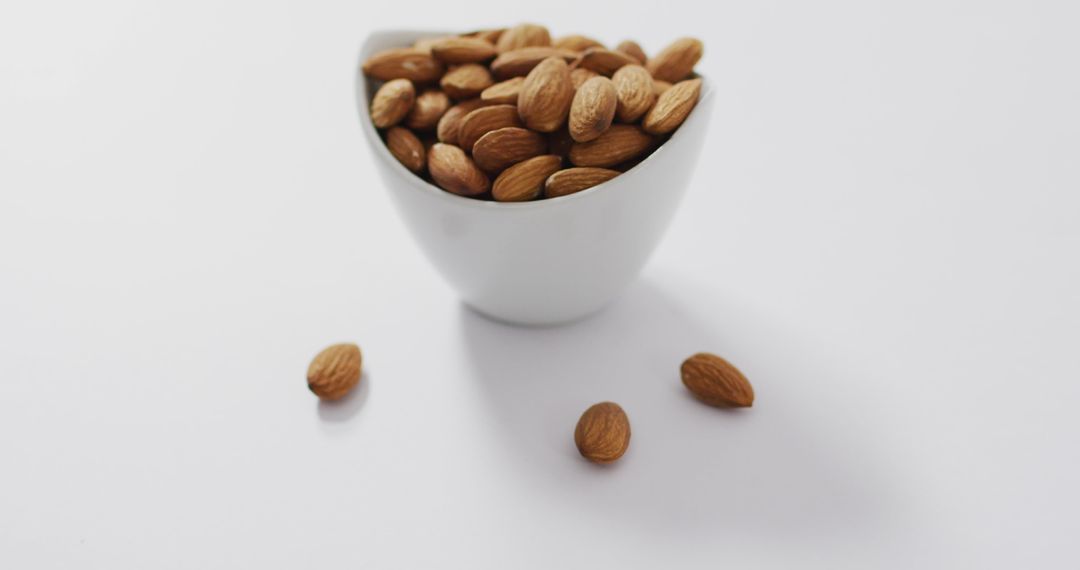 Almonds in White Bowl on Clean Surface