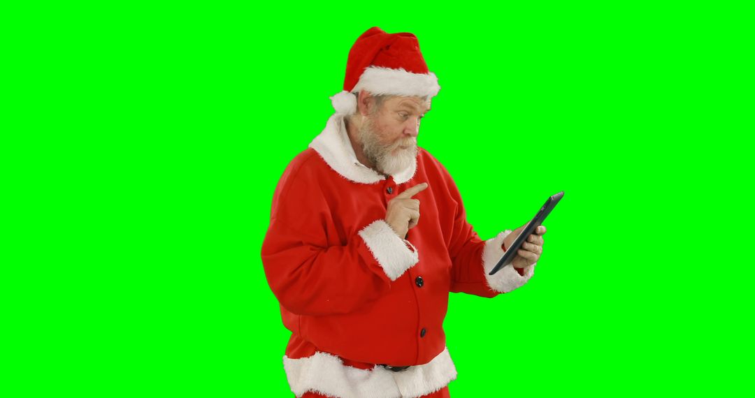 Santa Claus Holding and Using Tablet With Green Screen Background - Free Images, Stock Photos and Pictures on Pikwizard.com