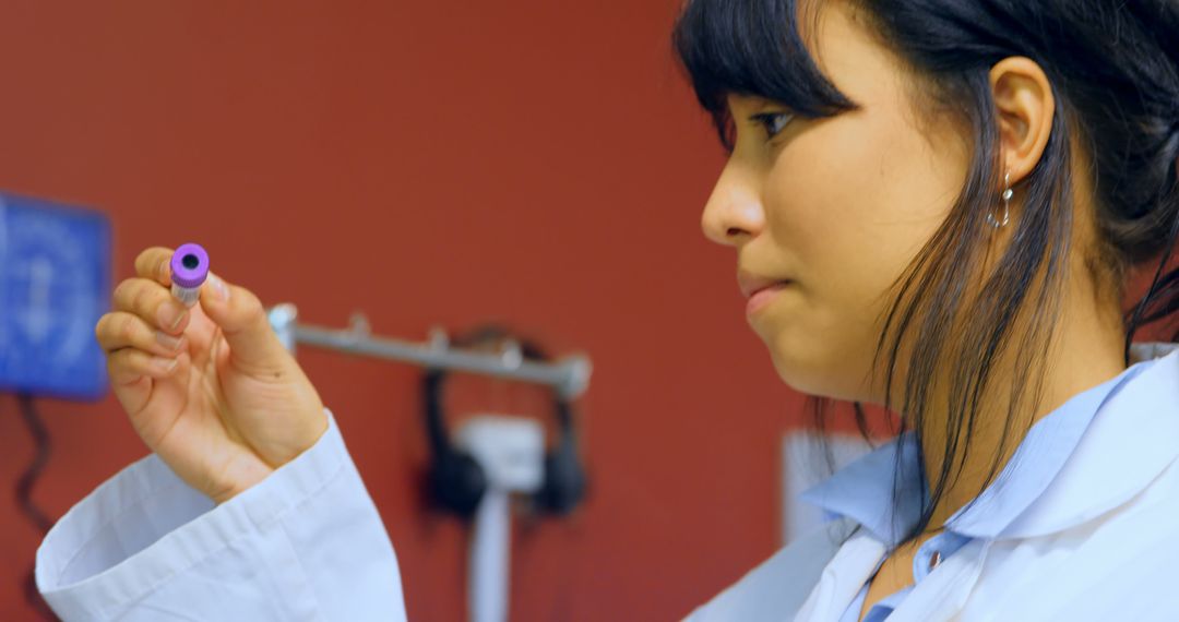 Dedicated Scientist Examining Test Tube in Laboratory - Free Images, Stock Photos and Pictures on Pikwizard.com