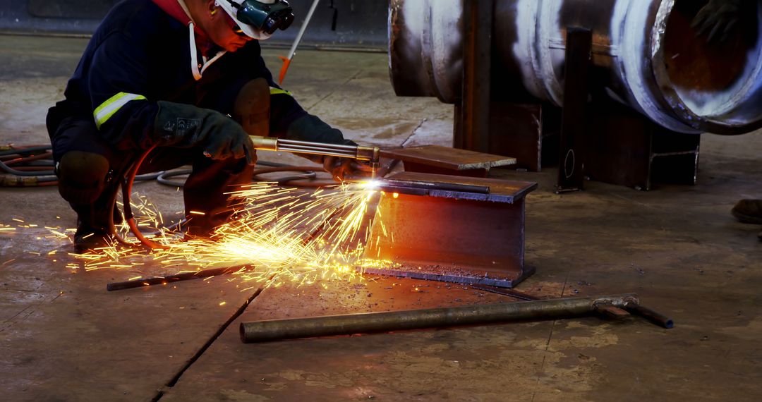 Industrial Worker Welding Metal with Sparks Flying - Free Images, Stock Photos and Pictures on Pikwizard.com