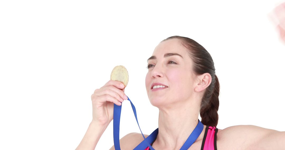 Smiling Female Athlete Celebrating with Gold Medal - Free Images, Stock Photos and Pictures on Pikwizard.com