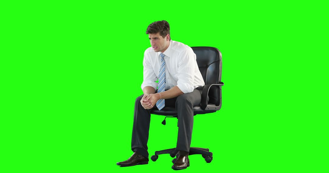 Stressed Businessman Sitting on Office Chair Against Green Screen - Free Images, Stock Photos and Pictures on Pikwizard.com