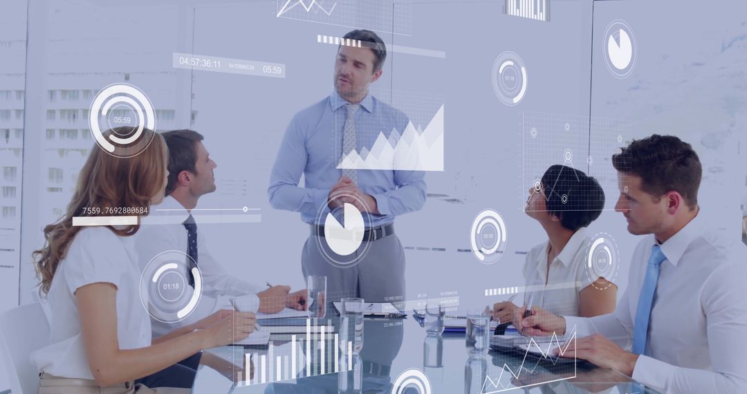 Colleagues Collaborating on Financial Data in Modern Office