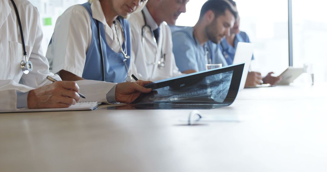 Medical Team Reviewing X-ray Results in Conference Room - Free Images, Stock Photos and Pictures on Pikwizard.com