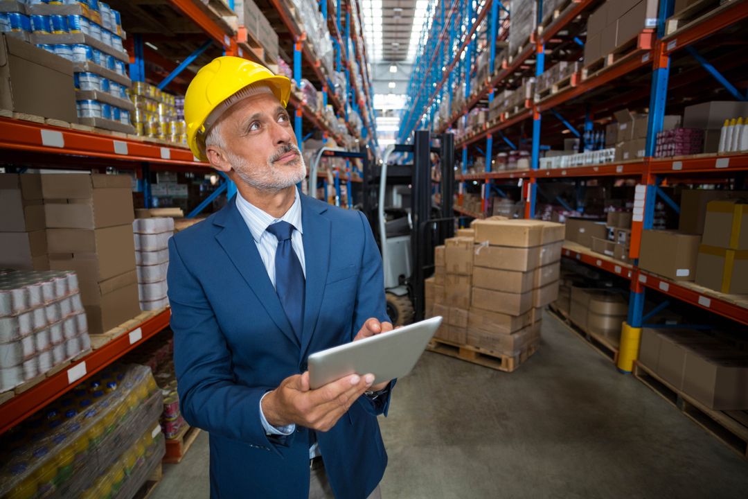 Experienced Manager Overseeing Warehouse Operations with Technology