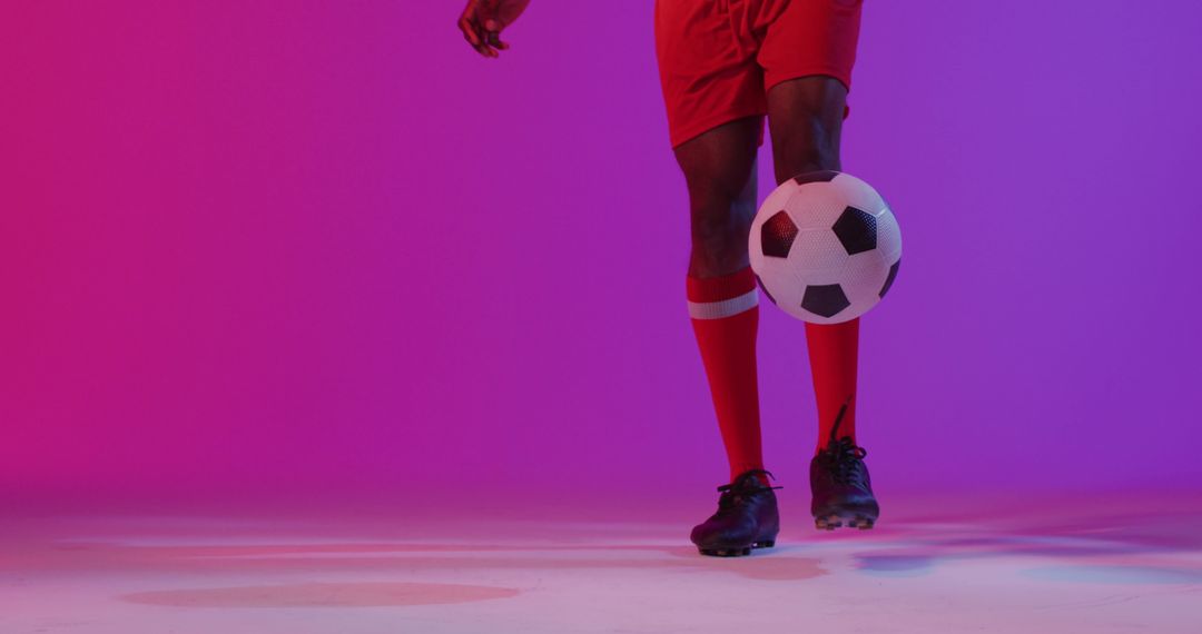 Creative Soccer Player in Dynamic Colorful Lighting