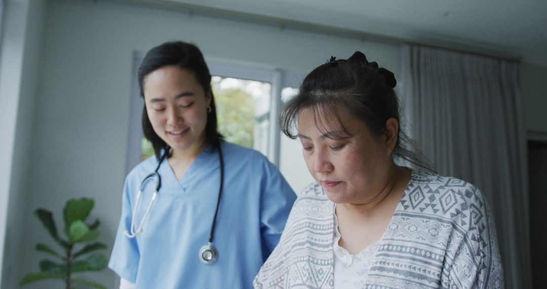 Nurse Assisting Patient in Home Healthcare Setting - Free Images, Stock Photos and Pictures on Pikwizard.com