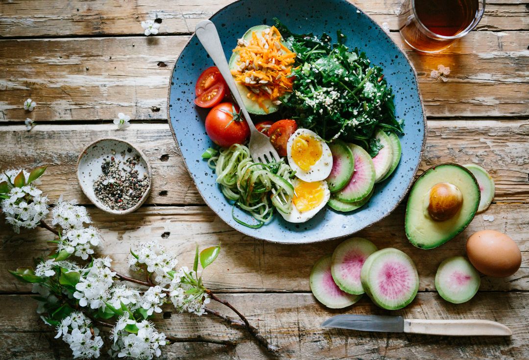 Spring avocado and soft-boiled egg bowl with zucchini noodles and watermelon radish