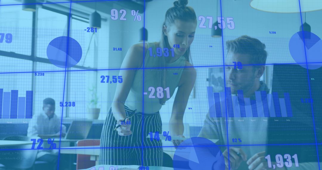 Business Colleagues Analyzing Financial Data in Office