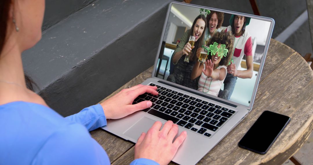 Woman Video Calling Friends on Laptop Inside Café
