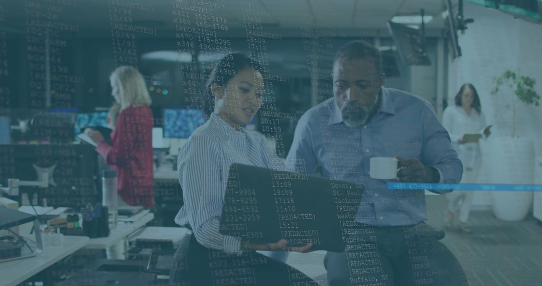 Business Professionals Collaborating in Tech-Focused Office Environment