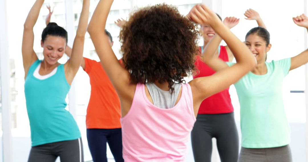 Group of Women Exercising Together in Fitness Class - Free Images, Stock Photos and Pictures on Pikwizard.com