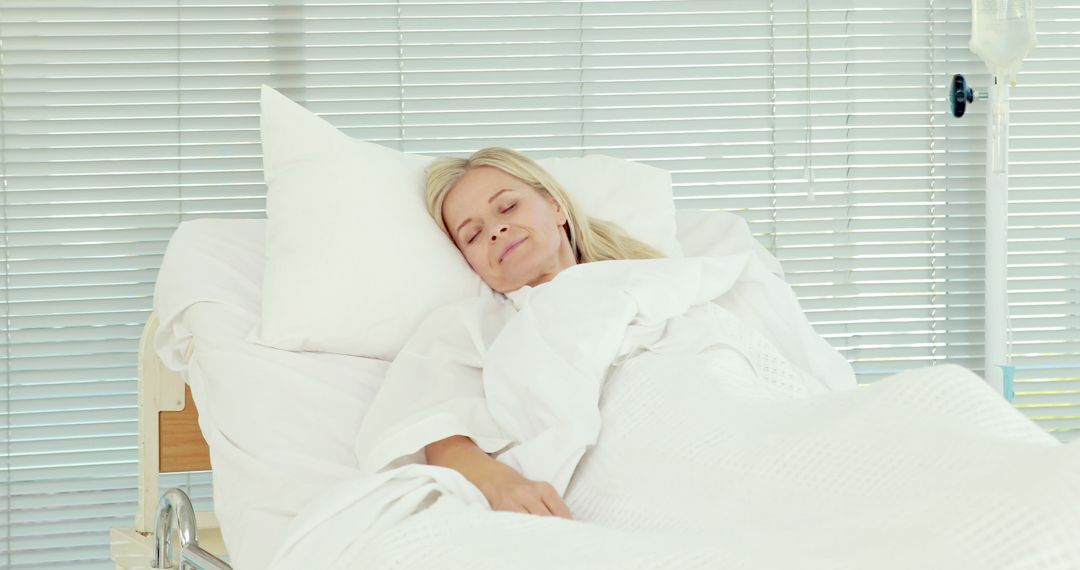 Middle-Aged Woman Resting Comfortably in Hospital Bed - Free Images, Stock Photos and Pictures on Pikwizard.com