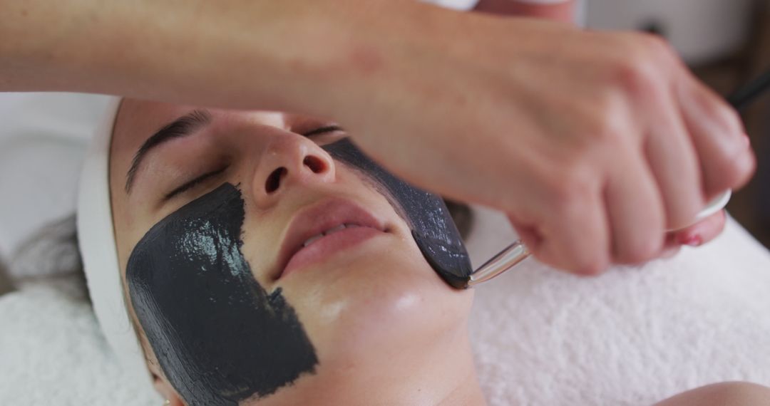 Relaxed Woman Enjoying Charcoal Facial Treatment at Beauty Spa - Free Images, Stock Photos and Pictures on Pikwizard.com