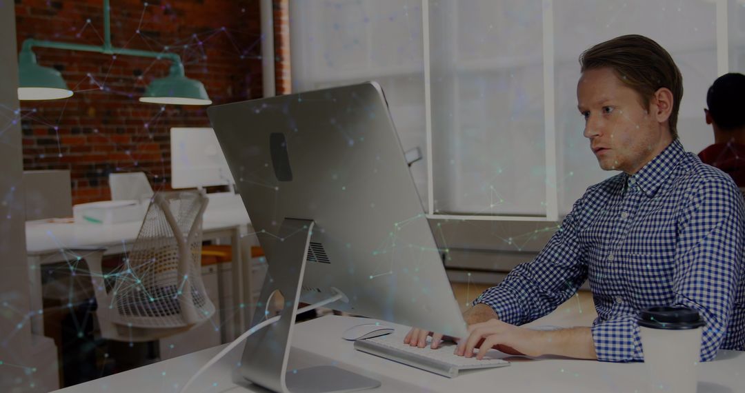 Businessman Exploring Network Connections on Computer Screen