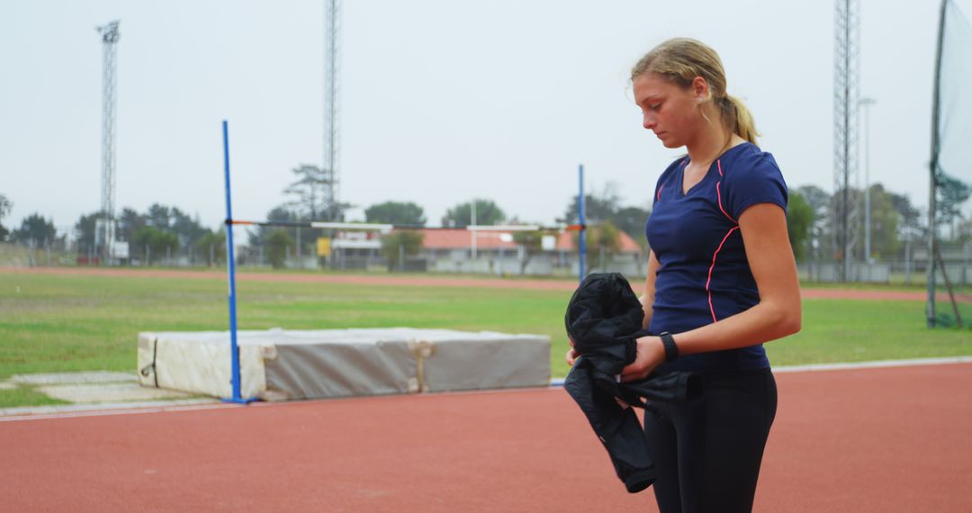 Female athlete preparing for track and field training - Free Images, Stock Photos and Pictures on Pikwizard.com