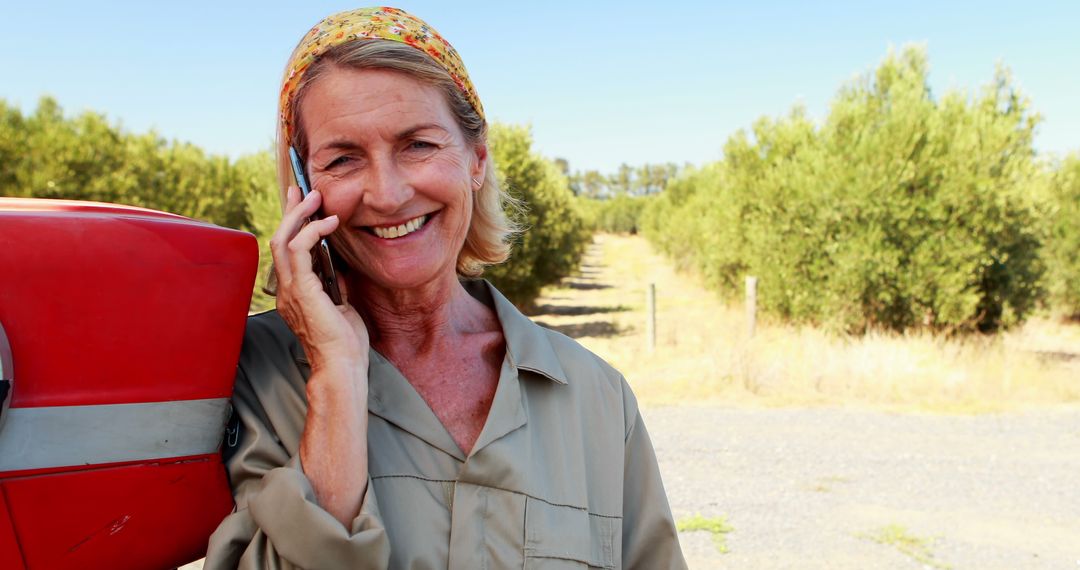 Senior Woman Farmer in Field Talking on Mobile Phone - Free Images, Stock Photos and Pictures on Pikwizard.com