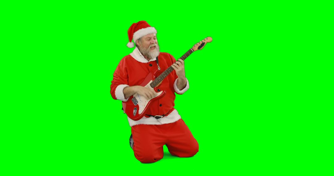 Santa Claus Performing with Electric Guitar on Green Background - Free Images, Stock Photos and Pictures on Pikwizard.com