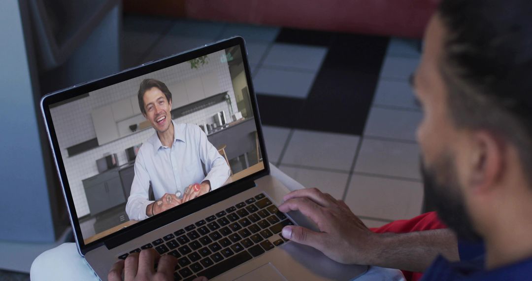 Man Engaging in Video Conference Call Using Laptop