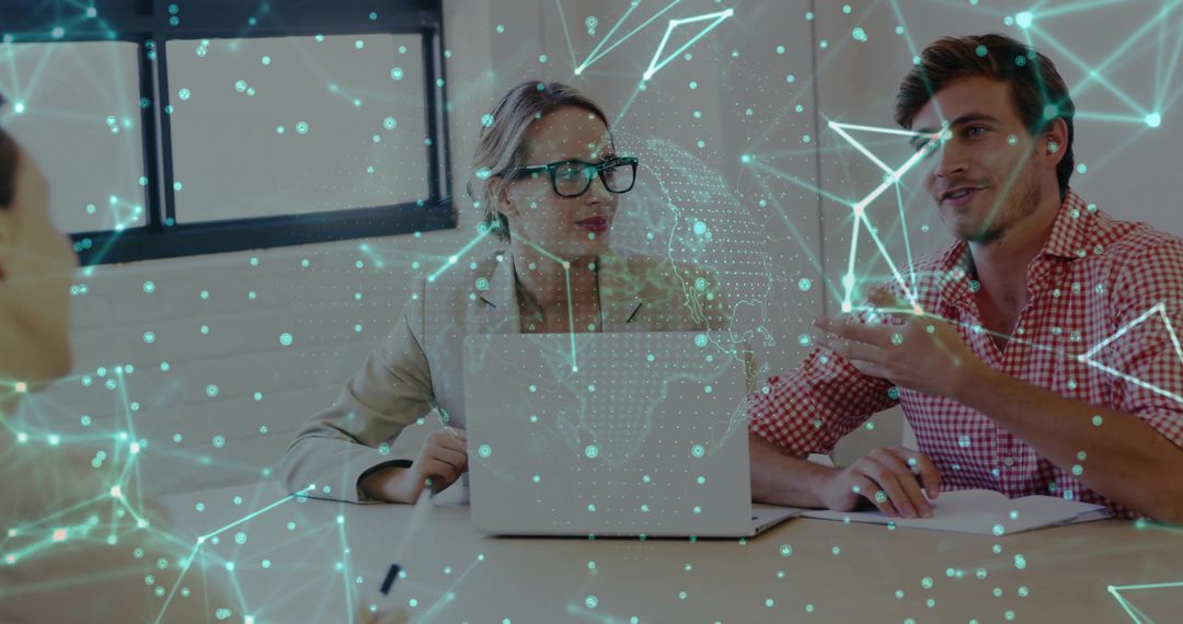 Business team collaborating over laptop with holographic network overlay for tech strategy