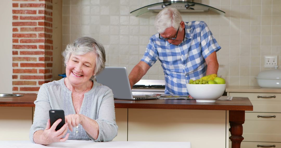 Senior Couple Using Technology in Modern Kitchen